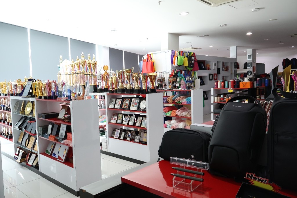 Allan D'Lious showroom with trophies, bags and corporate gifts