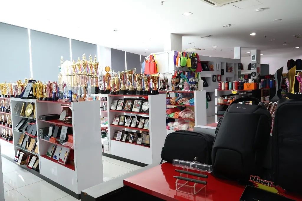 Allan D'Lious showroom with trophies, bags and corporate gifts